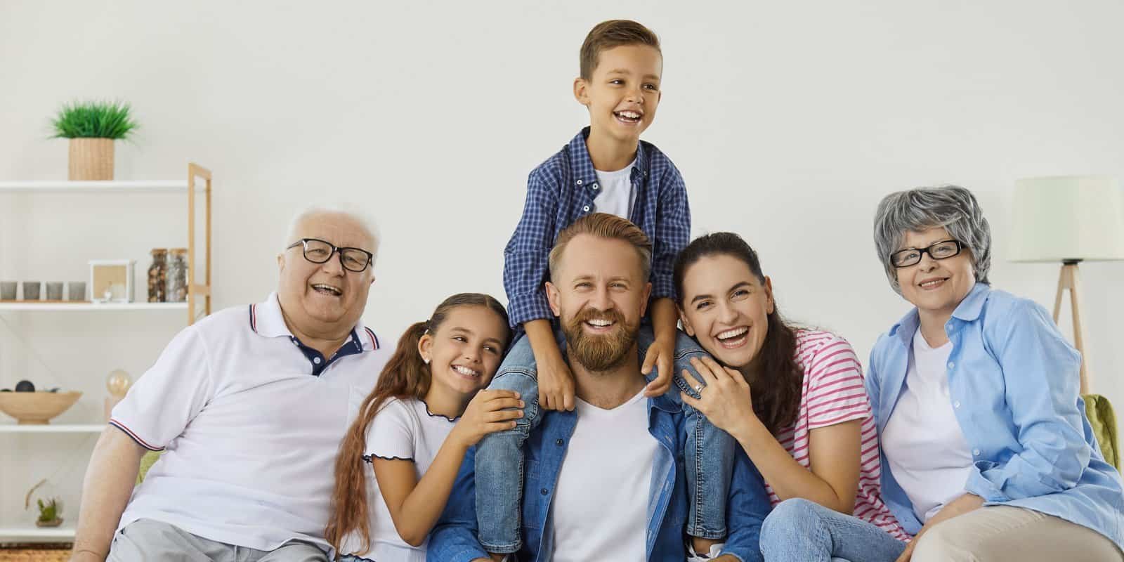Three generations of a family together on a sofa